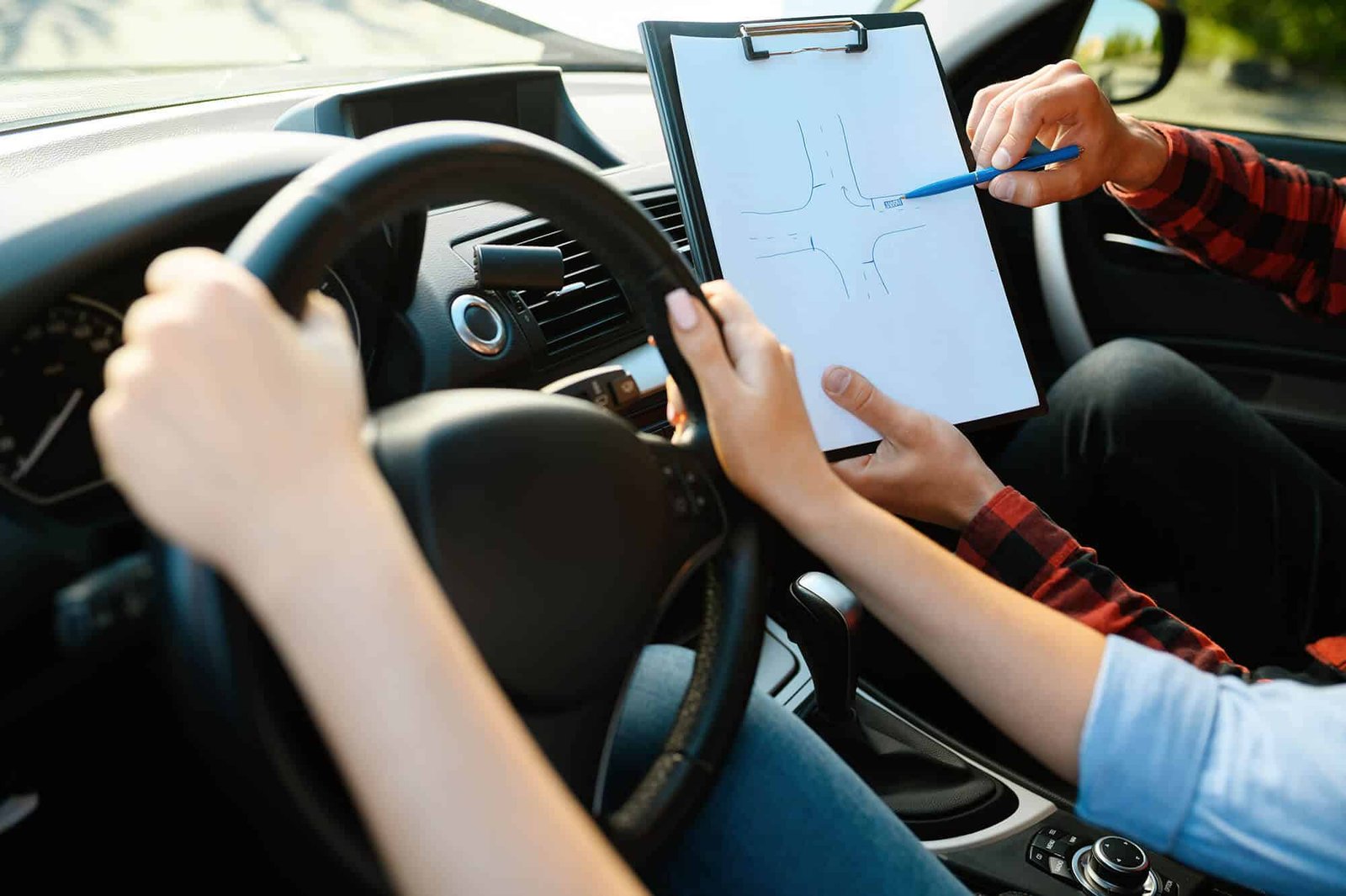 Learner and instructor discussing a driving lesson